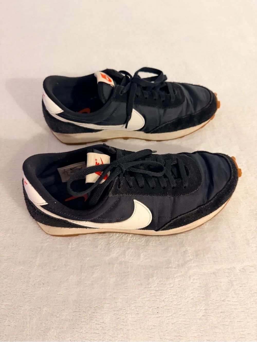 Nike Women’s Black Sneakers with White and Orange Accents